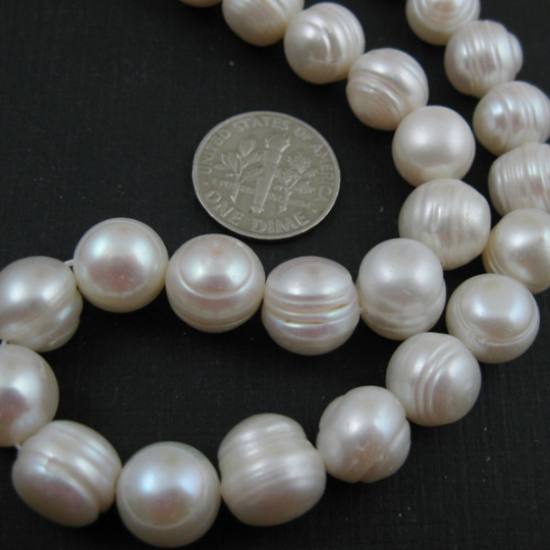 Wholesale Creamy Colored Freshwater Pearls, 10-11mm Round Shape with Rings - June Birthstone (Sold Per Strand)